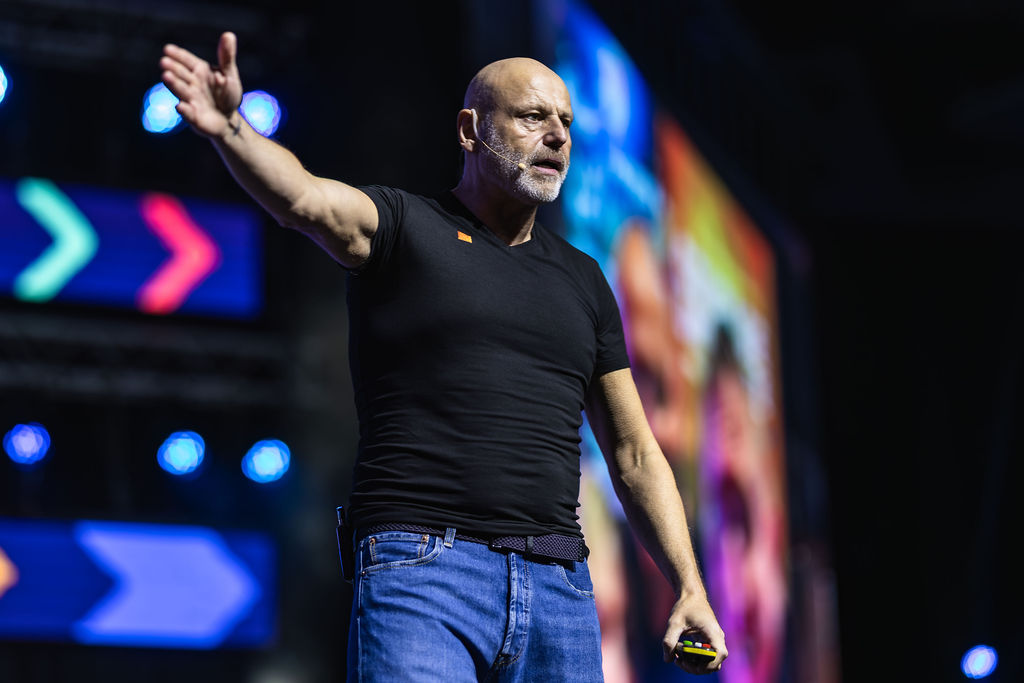 Brad Burton electrifying a large conference audience